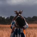 Woman holding hands in crossed mudra
